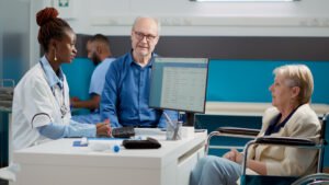 image by dcstudio on freepik General Practitioner Talking Old Woman Wheelchair Her Husband Doing Checkup Consultation Help With Recovery Treatment Medic Examining Patient With Chronic Impairment