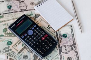 Photo by karolina grabowska: https://www. Pexels. Com/photo/calculator-and-notepad-placed-on-usa-dollars-stack-4386366/ Pexels Karolina Grabowska 4386366